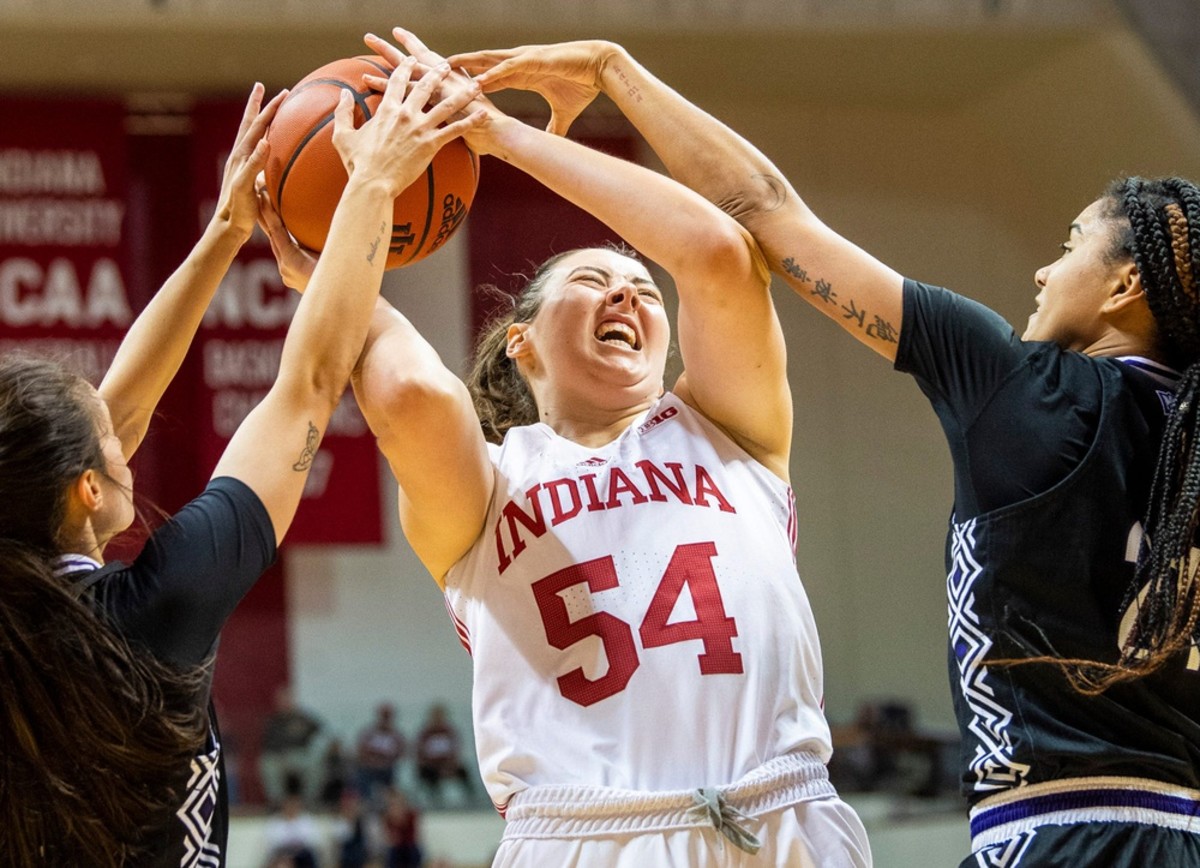 Indiana's Mackenzie Holmes (540 battles a double team during the Indiana versus Kentucky Wesleyan women's basketball game at Simon Skjodt Assembly Hall on Friday, Nov. 4, 2022.