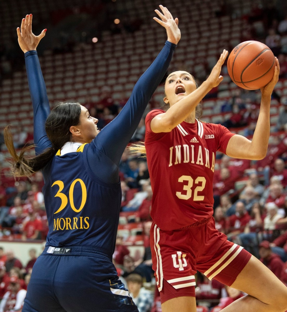 Indiana's Alyssa Geary (32) scores over Quinnipiac's Mikala Morris (30) during the Indiana versus Quinnipiac women's basketball game at Simon Skjodt Assembly Hall on Sunday, Nov. 20, 2022.