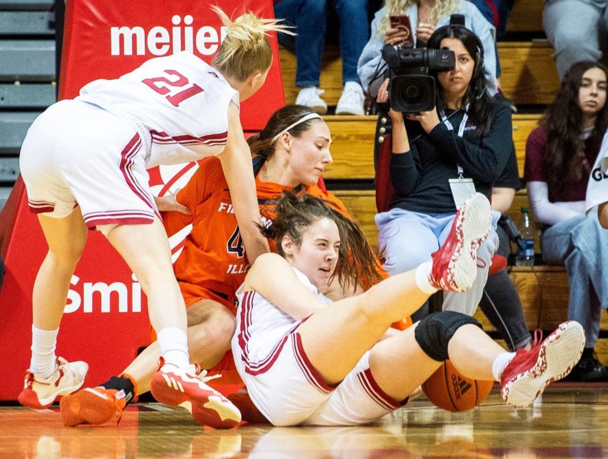 Indiana's Mackenzie Holmes (54) battles with Illinois' Kendall Bostic (44) for a loose ball during the first half of the Indiana versus Illiniois women's basketball game at Simon Skjodt Assembly Hall on Sunday, Dec. 4, 2022.