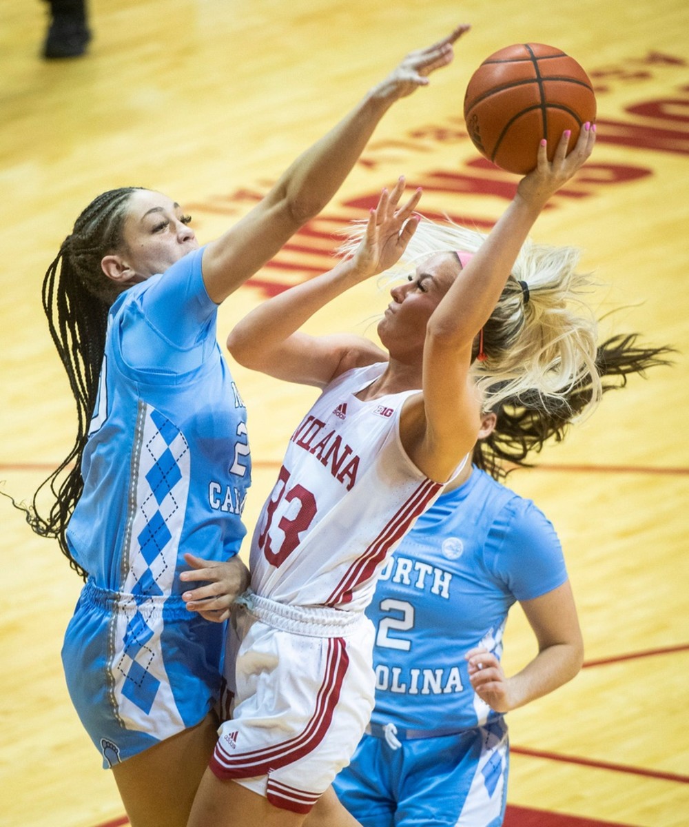 Indiana's Sydney Parrish (33) scores and is fouled by North Carolina's Destiny Adams (20) during the second half of the Indiana versus North Carolina women's basektball game at Simon Skjodt Assembly Hall on Thursday, Dec. 1, 2022.