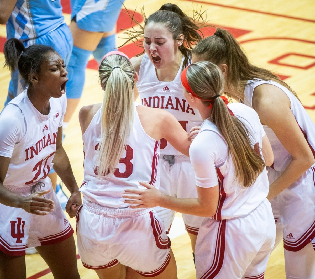 Indiana's Chloe Moore-McNeil (22), Mackenzie Holmes (54) Yarden Garzon (12) and Sara Scalia (14) celebrate with Sydney Parrish (33) after she scored and is fouled by North Carolina's Destiny Adams (20) during the second half of the Indiana versus North Carolina women's basketball game at Simon Skjodt Assembly Hall on Thursday, Dec. 1, 2022.
