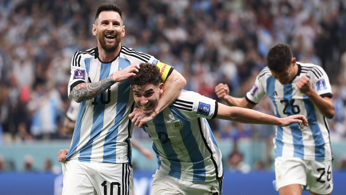 Lionel Messi and Julian Alvarez celebrate an Argentina goal vs. Croatia