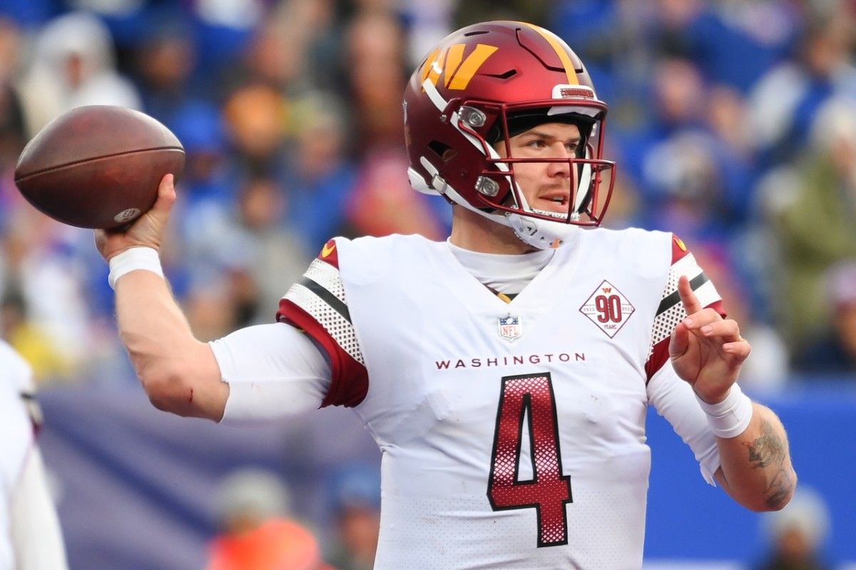 Washington Commanders quarterback Taylor Heinicke (4) passes the ball against the New York Giants during the second half at MetLife Stadium.