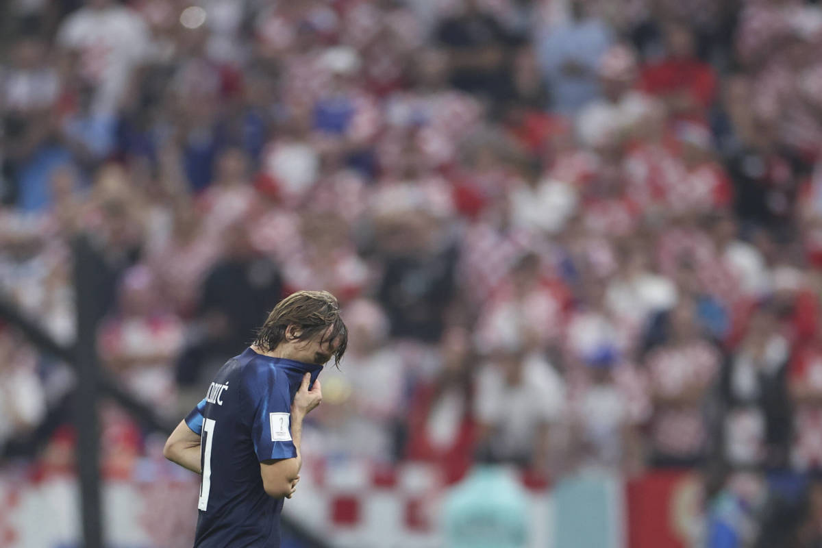 Luka Modric pictured looking disappointed while leaving the field during Croatia's 3-0 loss to Argentina in their 2022 World Cup semi-final