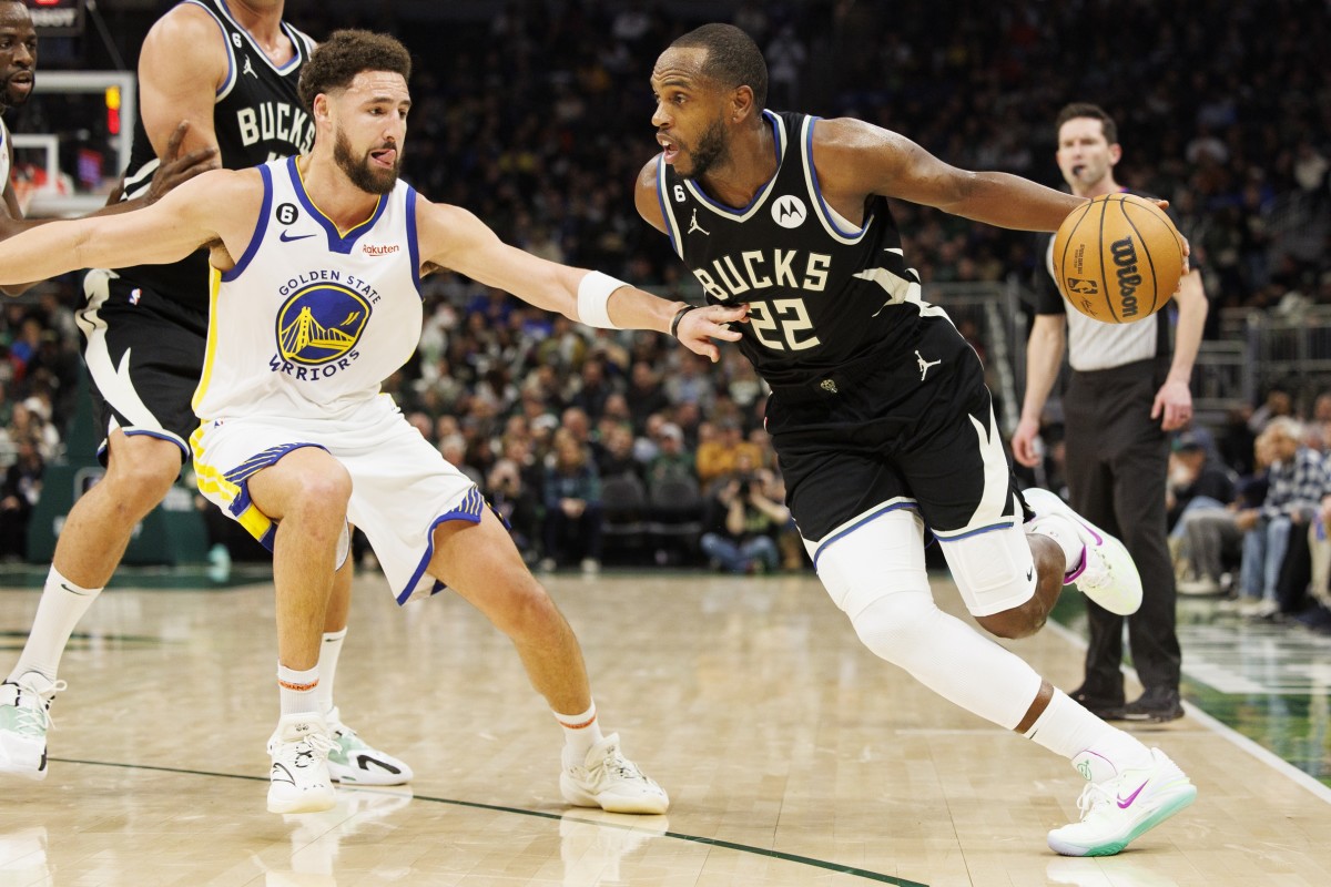 Milwaukee Bucks forward Khris Middleton (22) drives for the basket against Golden State Warriors guard Klay Thompson (11)