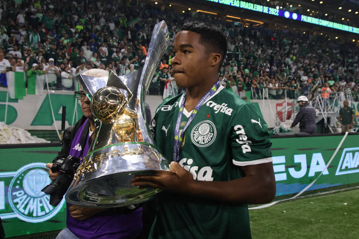 Endrick pictured holding the Campeonato Brasileiro Serie A trophy after Palmeiras were crowned champions in November 2022