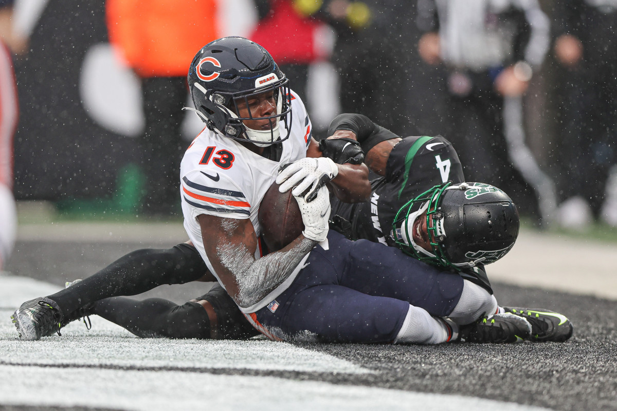 Chicago Bears wide receiver Byron Pringle catches a touchdown reception and is on the ground while a Jets defender tackles him