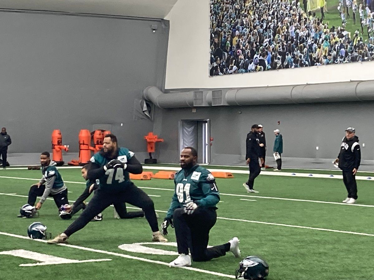 Ndamukong Suh (74) and Fletcher Cox (91) stretch prior to practice on Dec. 15, 2022