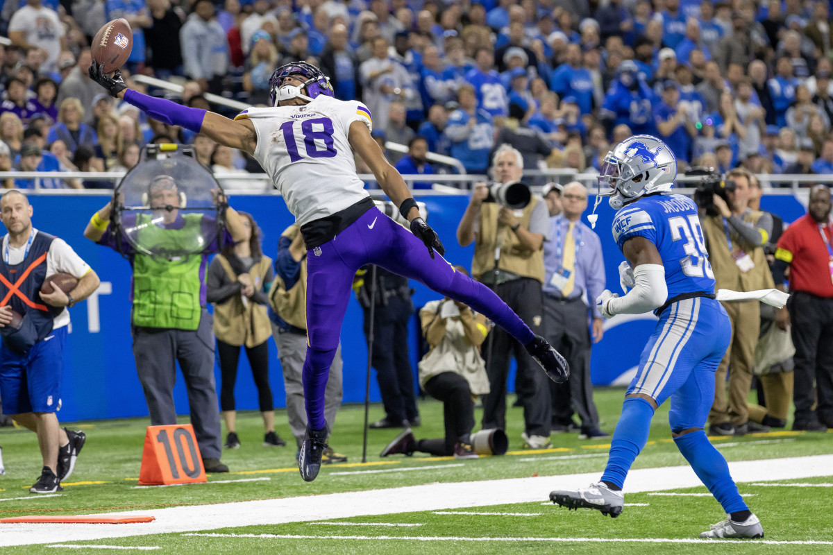 Dec 11, 2022; Detroit, Michigan, USA; Minnesota Vikings wide receiver Justin Jefferson (18) is unable to make a catch in front of Detroit Lions cornerback Jerry Jacobs (39) during the second half at Ford Field. Mandatory Credit: David Reginek-USA TODAY Sports