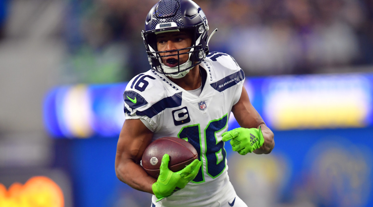 Dec 4, 2022; Inglewood, California, USA; Seattle Seahawks wide receiver Tyler Lockett (16) runs the ball for a touchdown against the Los Angeles Rams during the first half at SoFi Stadium. Mandatory Credit: Gary A. Vasquez-USA TODAY Sports