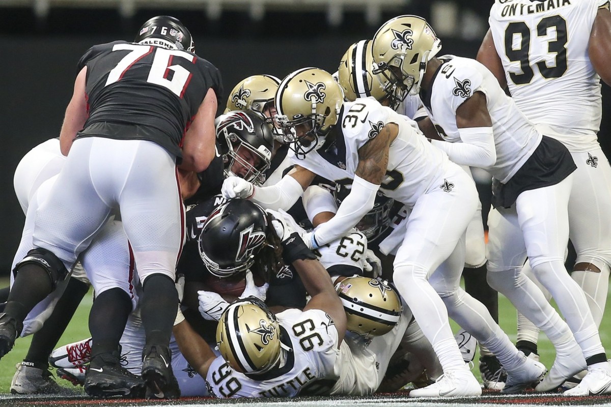 Atlanta Falcons running back Cordarrelle Patterson (84) is tackled by New Orleans Saints defensive tackle Shy Tuttle (99). Mandatory Credit: Brett Davis-USA TODAY Sports