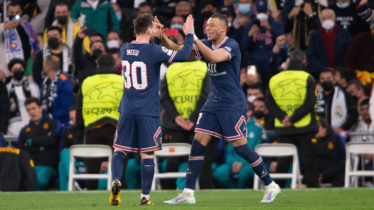 Lionel Messi and Kylian Mbappe celebrate a PSG goal in the Champions League