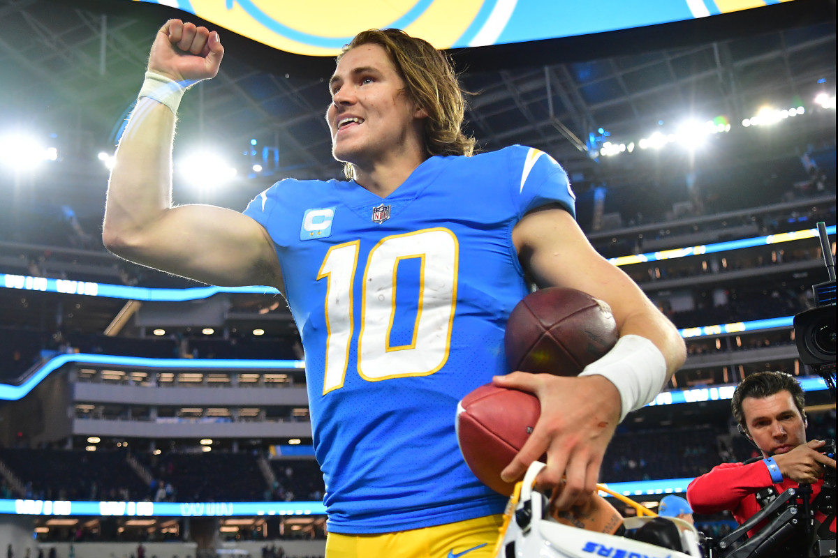 Dec 11, 2022; Inglewood, California, USA; Los Angeles Chargers quarterback Justin Herbert (10) celebrates the victory against the Miami Dolphins at SoFi Stadium. Mandatory Credit: Gary A. Vasquez-USA TODAY Sports