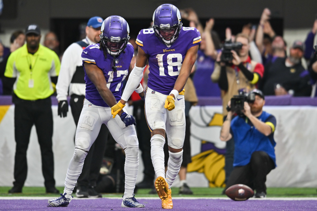 Dec 17, 2022; Minneapolis, Minnesota, USA; Minnesota Vikings wide receiver Justin Jefferson (18) reacts with wide receiver K.J. Osborn (17) after scoring a touchdown against the Indianapolis Colts during the fourth quarter at U.S. Bank Stadium. Mandatory Credit: Jeffrey Becker-USA TODAY Sports