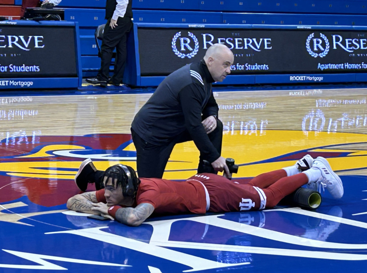 Indiana freshman guard Jalen Hood-Schifino working with director or athletic performance Clif Marshall before Saturday's game against Kansas at Allen Fieldhouse.