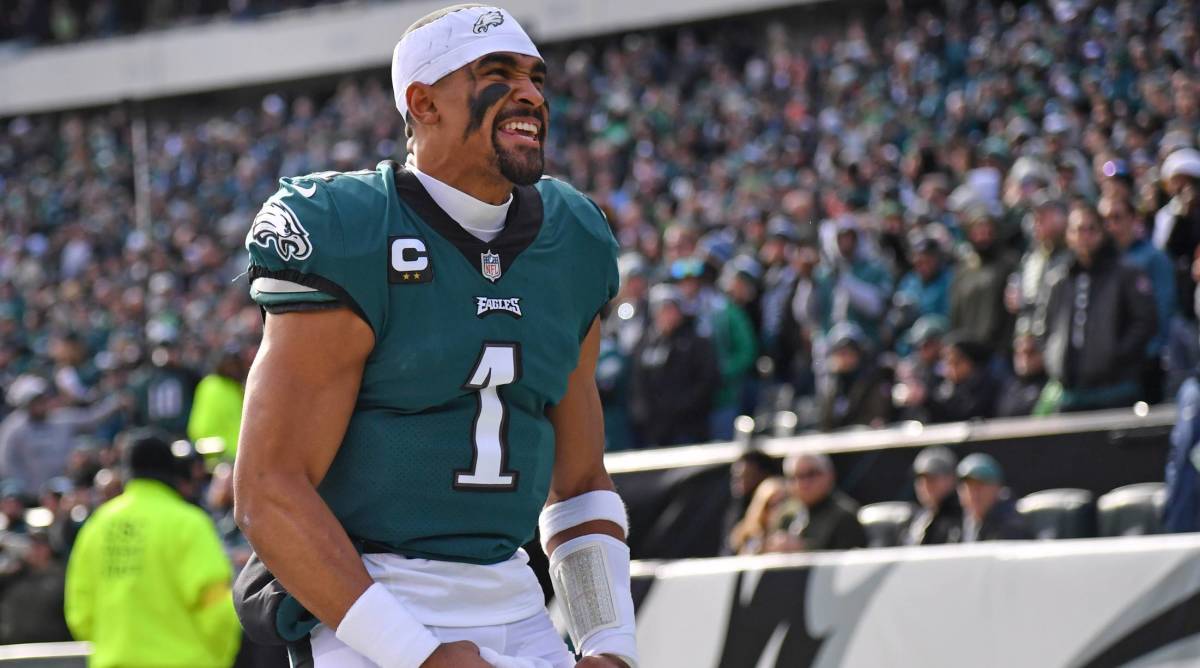 Eagles quarterback Jalen Hurts pumps up the crowd before a game vs. the Titans.