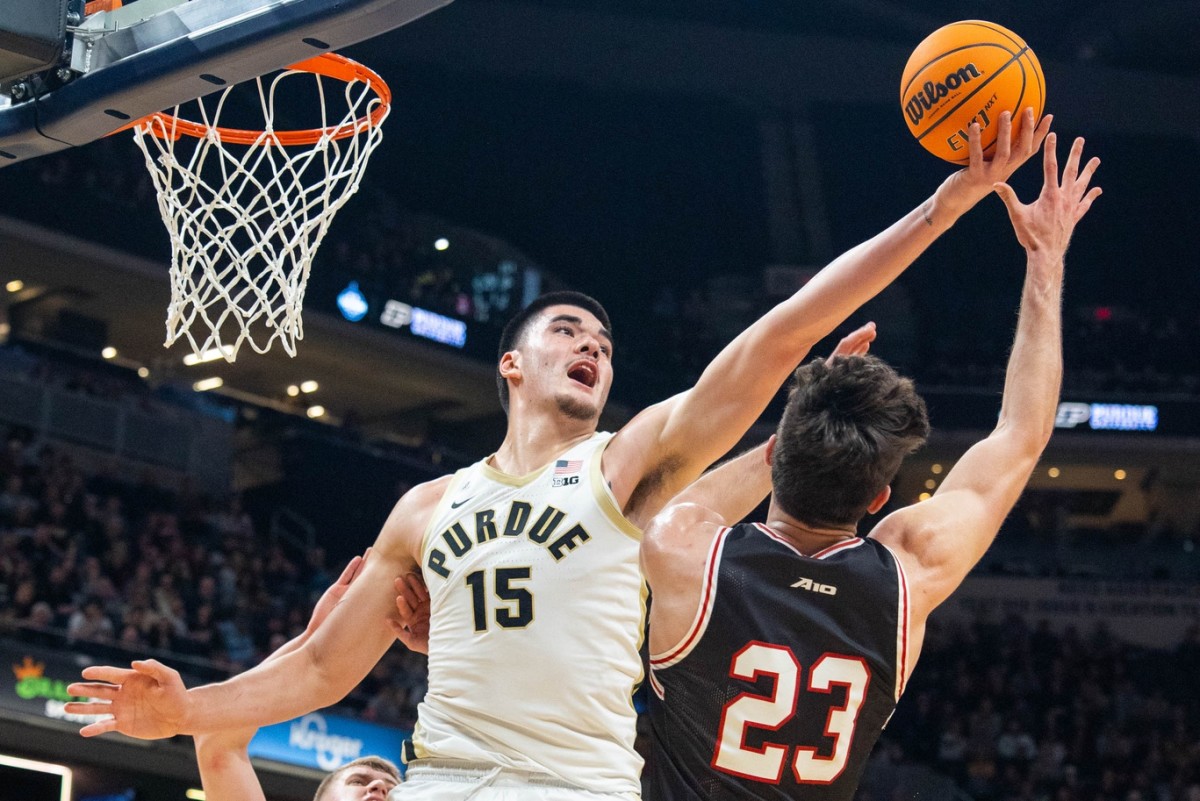 Dec 17, 2022; Indianapolis, Indiana, USA; Purdue Boilermakers center Zach Edey (15) rebounds the ball against Davidson Wildcats guard Connor Kochera (23) in the second half at Gainbridge Fieldhouse.