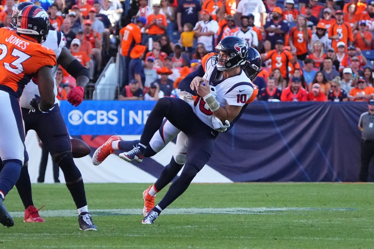 Denver Broncos linebacker Randy Gregory (5) sacks Houston Texans quarterback Davis Mills (10) in the fourth quarter at Empower Field at Mile High.