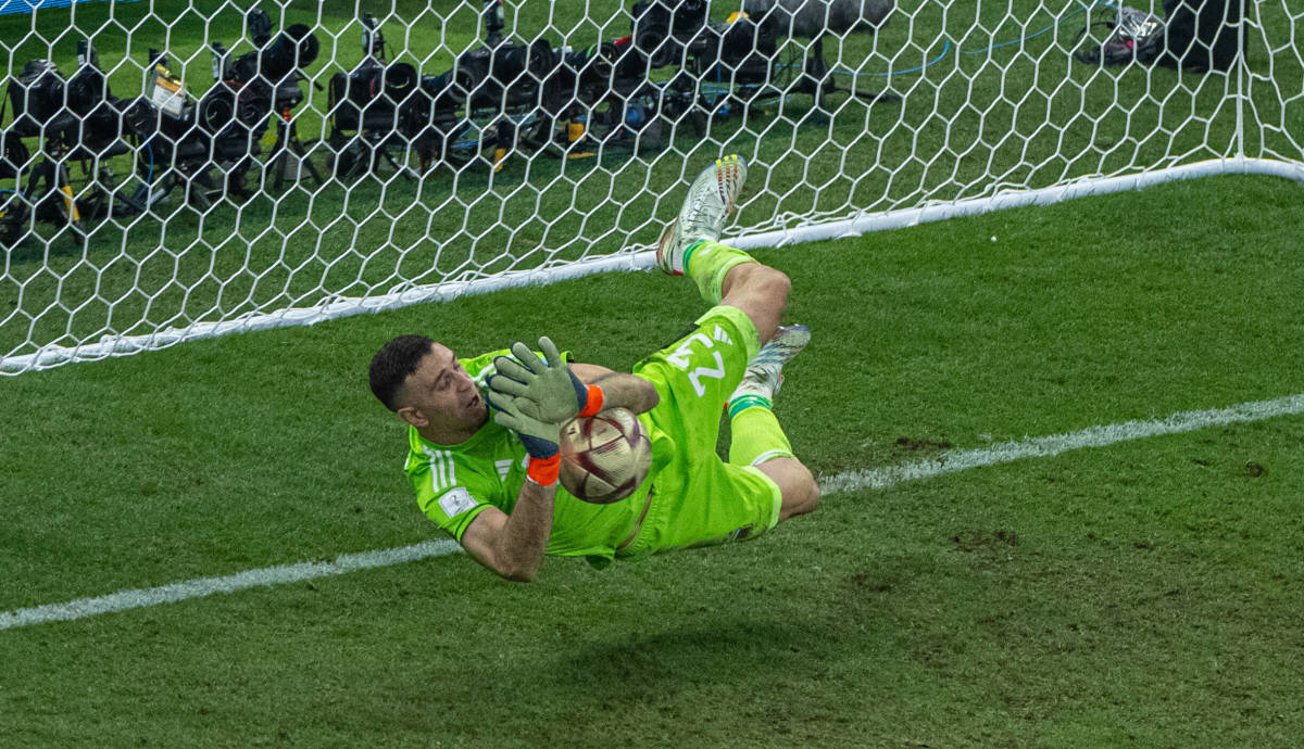 Argentina goalkeeper Emiliano Martinez pictured saving a penalty kick during the 2022 FIFA World Cup final