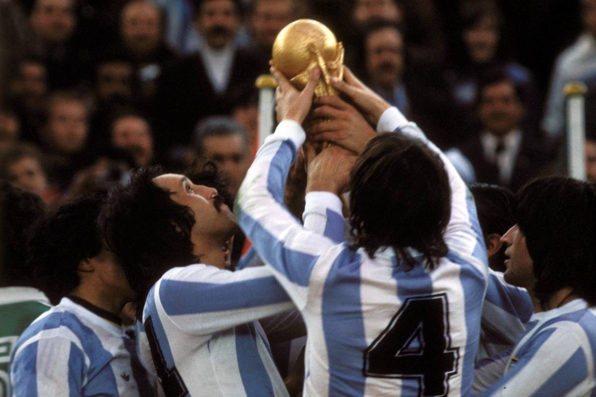 Players of Argentina pictured celebrating with the World Cup trophy in 1978