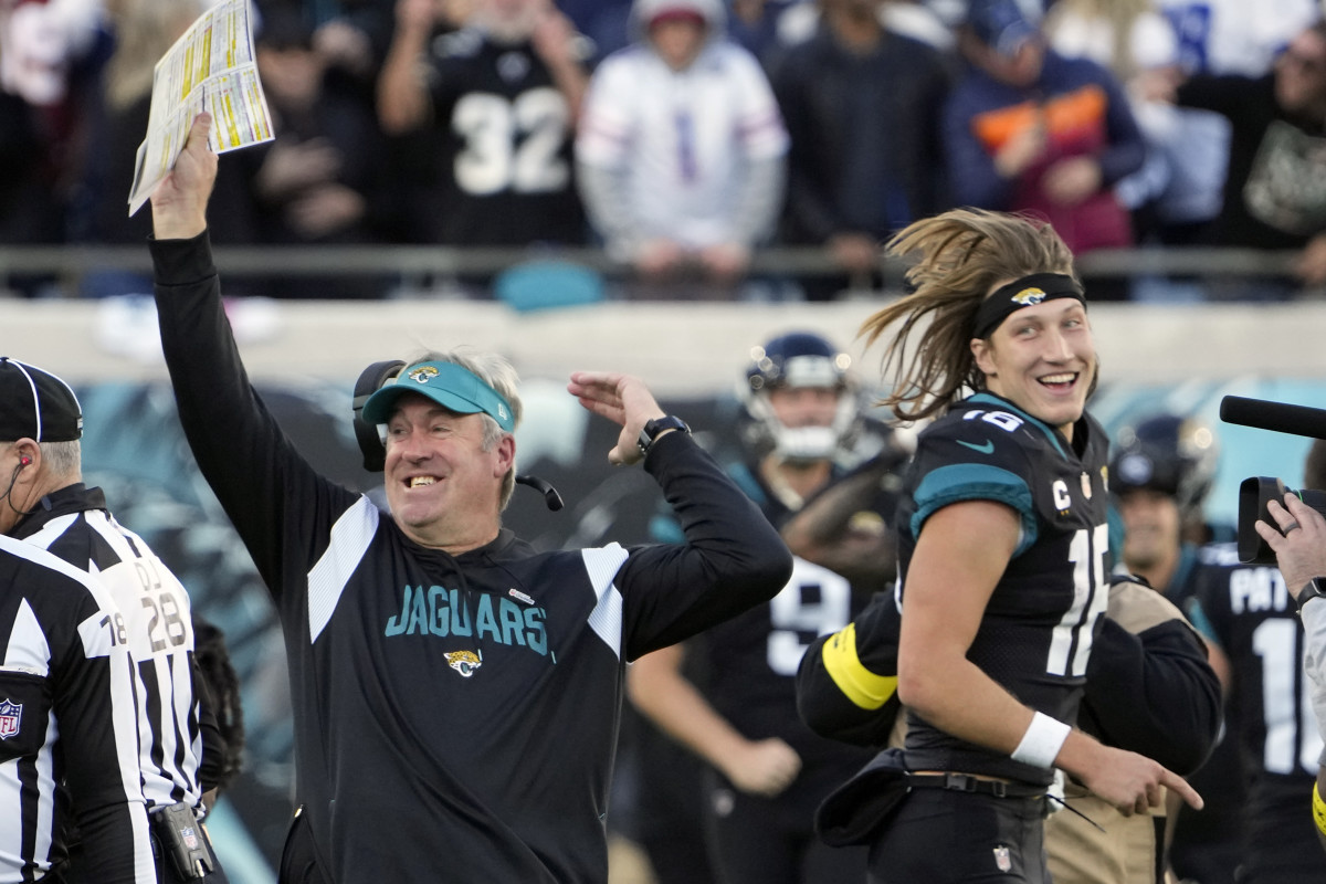 Doug Pederson and Trevor Lawrence celebrate the Jaguars' win over the Cowboys