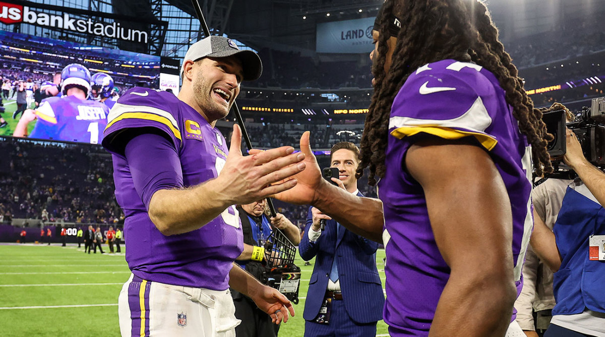 Kirk Cousins and K.J. Osborn celebrate the record comeback win against the Colts after the game at U.S. Bank Stadium.