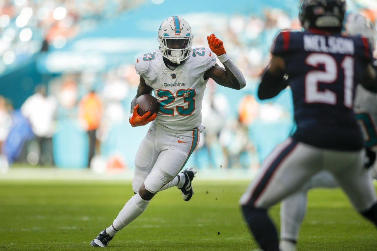 Miami Dolphins running back Jeff Wilson Jr. (23) runs with the football during the first quarter against the Houston Texans at Hard Rock Stadium.