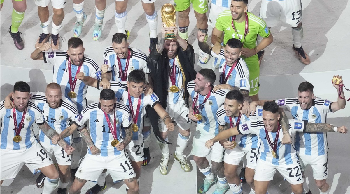 Lionel Messi lifting the World Cup trophy.