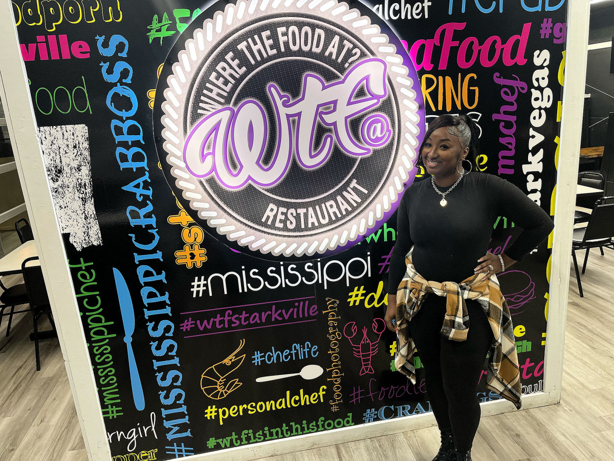 Shan Suber poses inside her restaurant, WTF