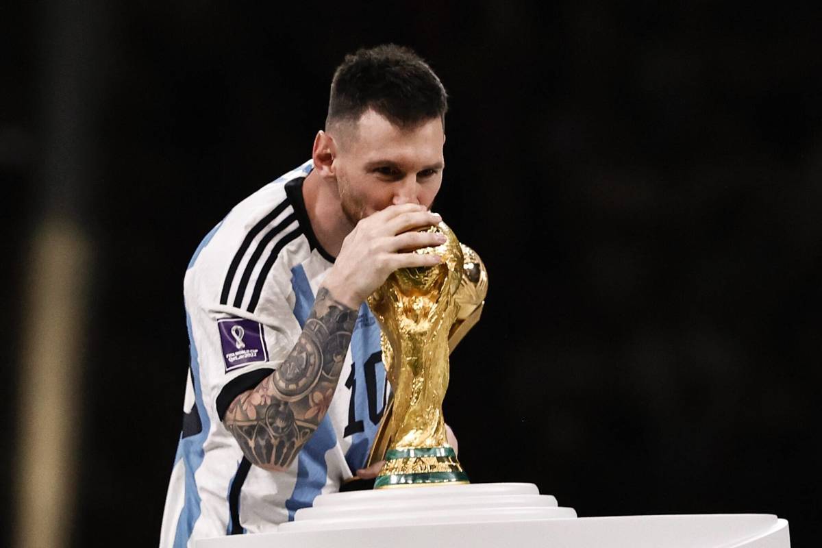 Lionel Messi pictured kissing the World Cup trophy after captaining Argentina to glory at Qatar 2022