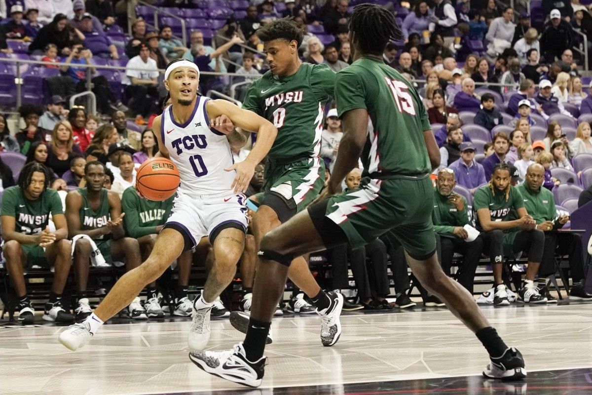 Dec 18, 2022; Fort Worth, Texas, USA; TCU Horned Frogs guard Micah Peavy (0) works around Mississippi Valley State Delta Devils guard Rayquan Brown (0) during the first half at Ed and Rae Schollmaier Arena