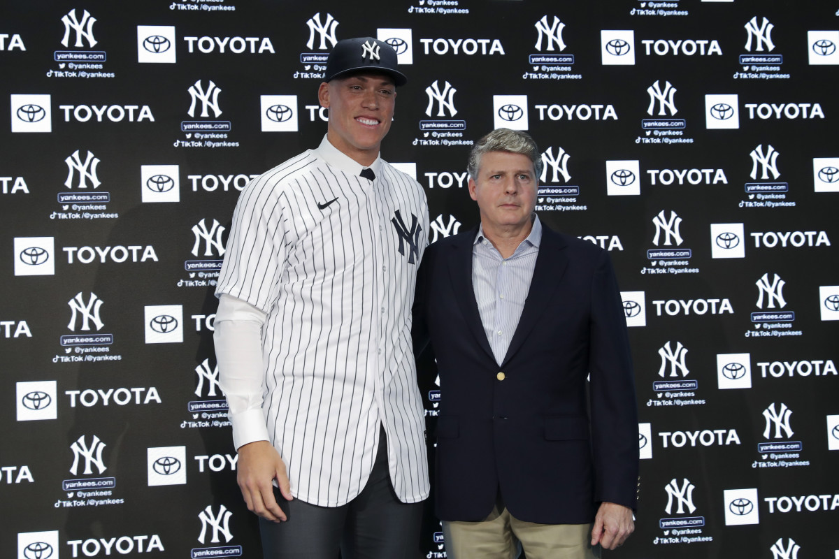 Aaron Judge poses with Yankees owner Hal Steinbrenner during a press conference after being named team captain at Yankee Stadium.