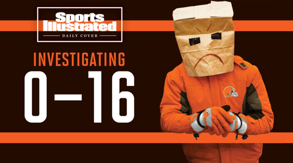 A Browns fan with a bag over his head with a frown on it