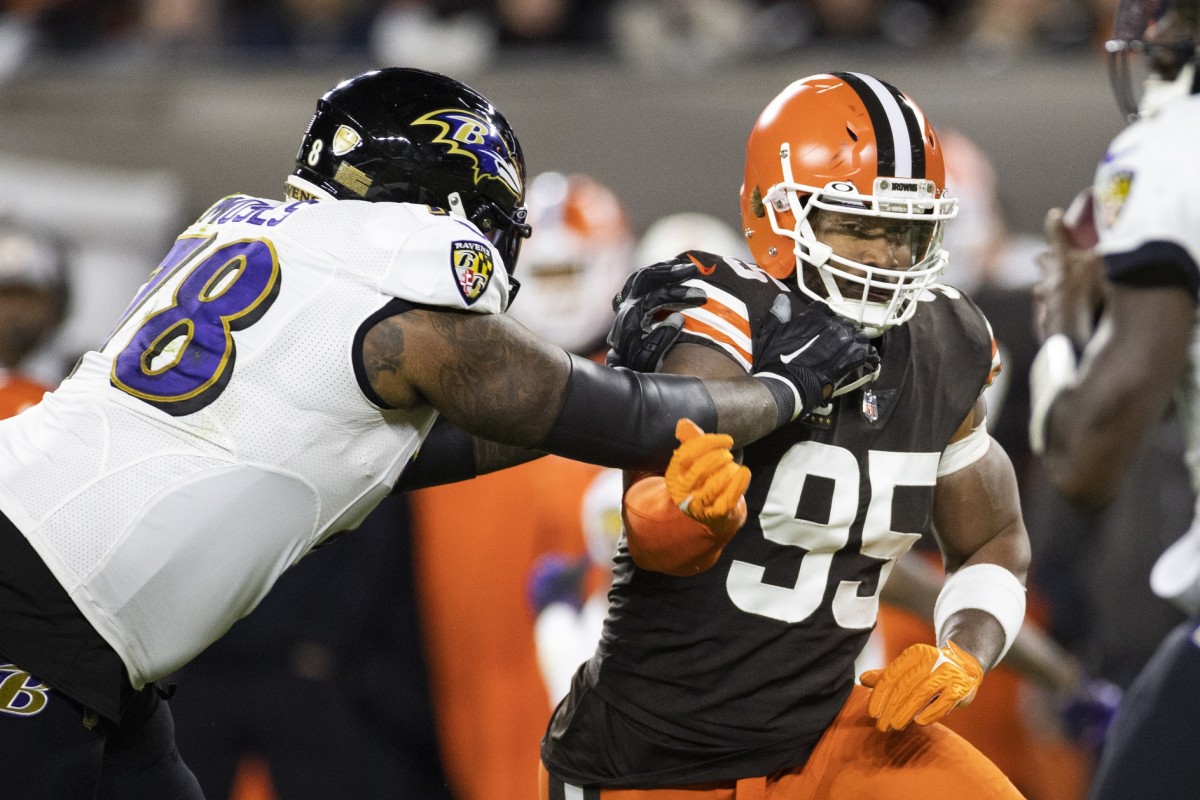 Cleveland Browns defensive end Myles Garrett (95) rushes around Baltimore Ravens offensive tackle Morgan Moses (78). Mandatory Credit: Scott Galvin-USA TODAY Sports