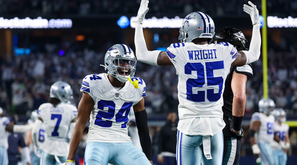 The Dallas defense celebrates after a play against the Eagles