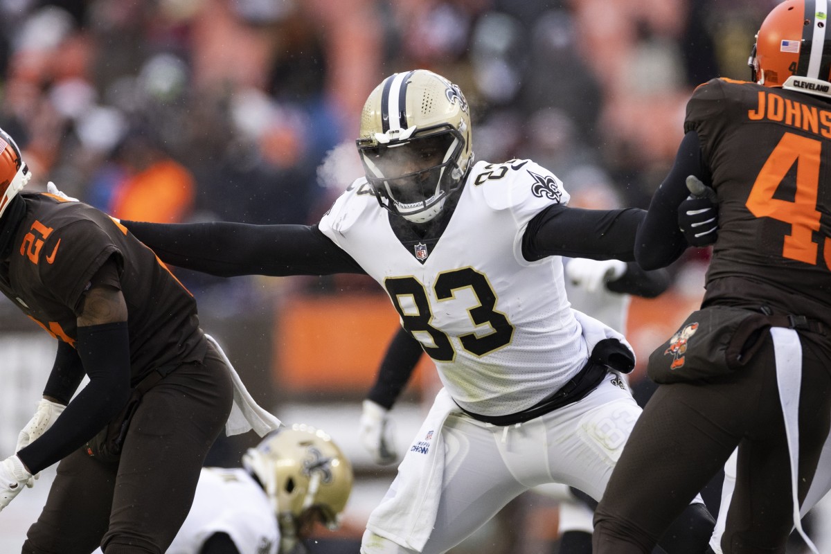 New Orleans Saints tight end Juwan Johnson (83) blocks Cleveland Browns cornerback Denzel Ward (21) and safety John Johnson III (43). Mandatory Credit: Scott Galvin-USA TODAY Sports