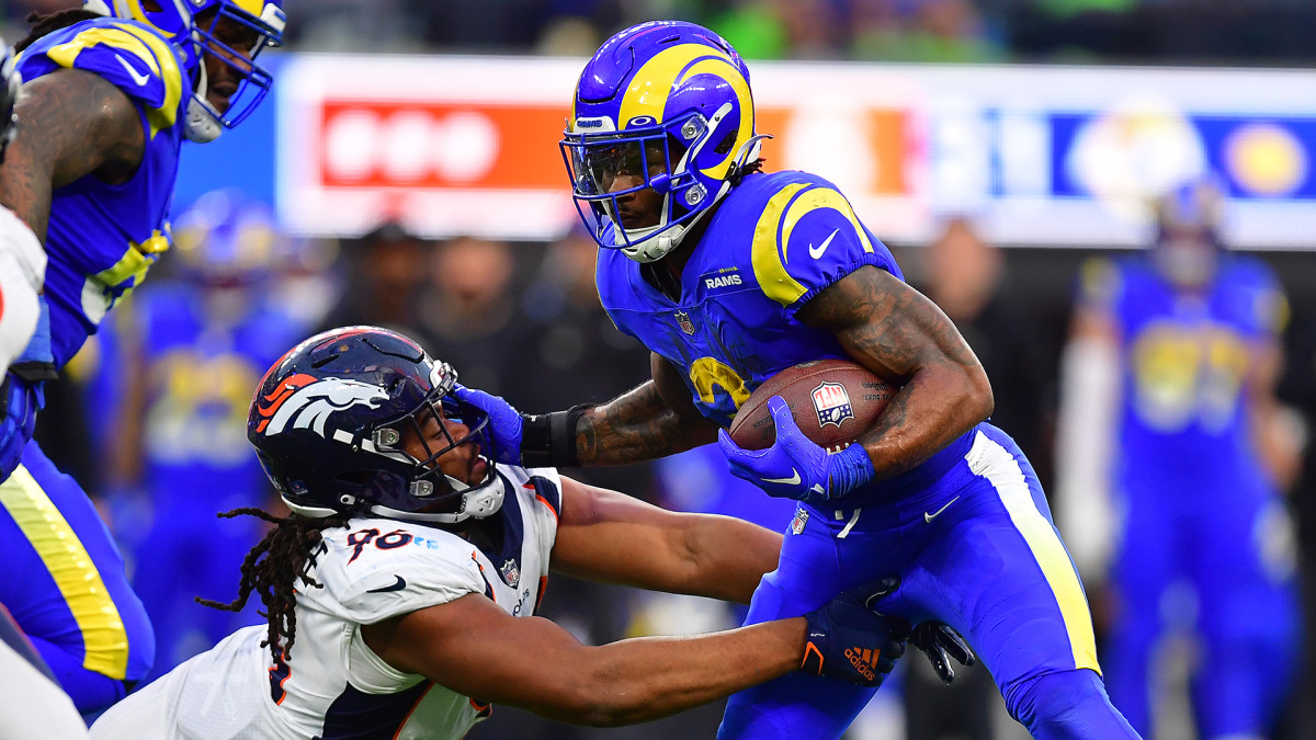 Cam Akers stiff-arms a Broncos defender
