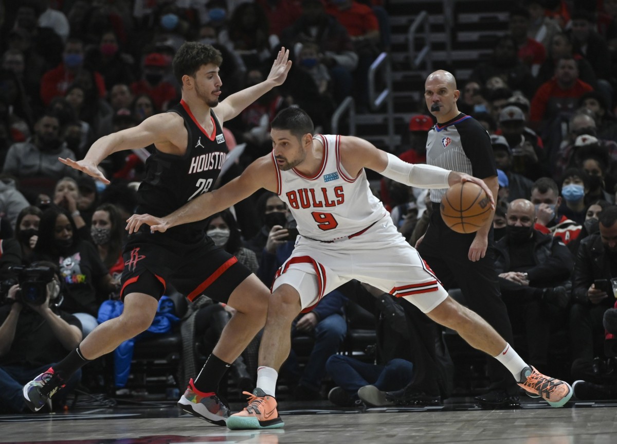 Houston Rockets center Alperen Sengun (28) defended against Chicago Bulls center Nikola Vucevic (9)