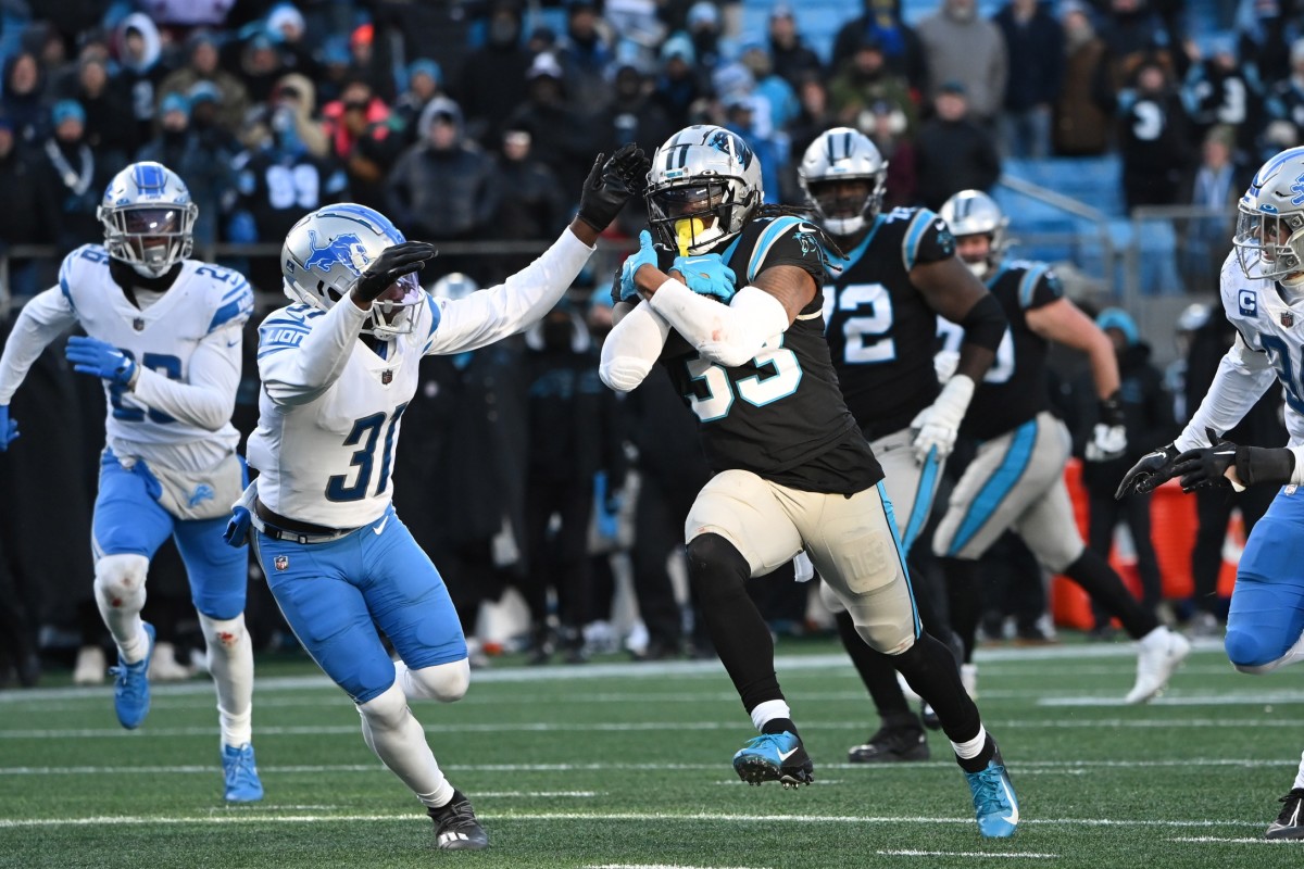 Panthers running back D'Onta Foreman runs through the Lions secondary in Week 16.