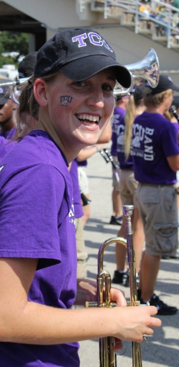 Tori (Cummings) Couch takes a quick break for a photo during a football pre-game pep rally in 2010.