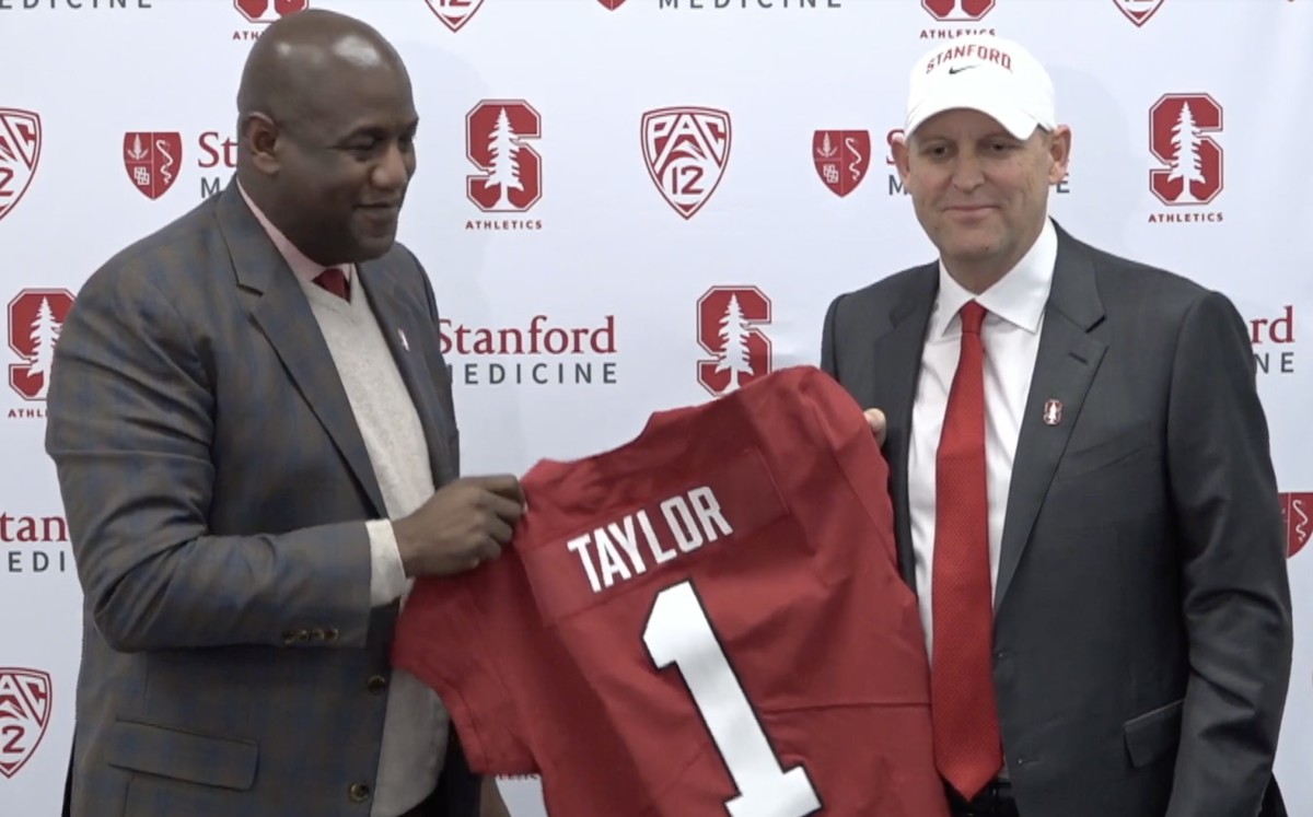 Troy Taylor poses with Stanford AD Bernard Muir