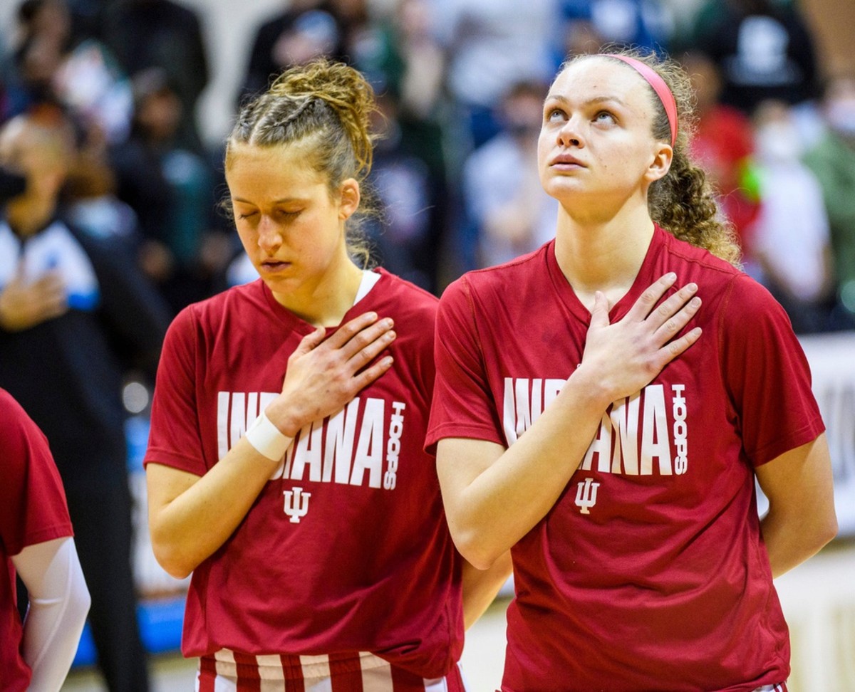 Indiana's Ali Patberg (14) and Grace Berger (34) during the National Anthem before the first half of the Indiana versus Charlotte women's NCAA First Round game at Simon Skjodt Assembly Hall on Saturday, March 19, 2022.