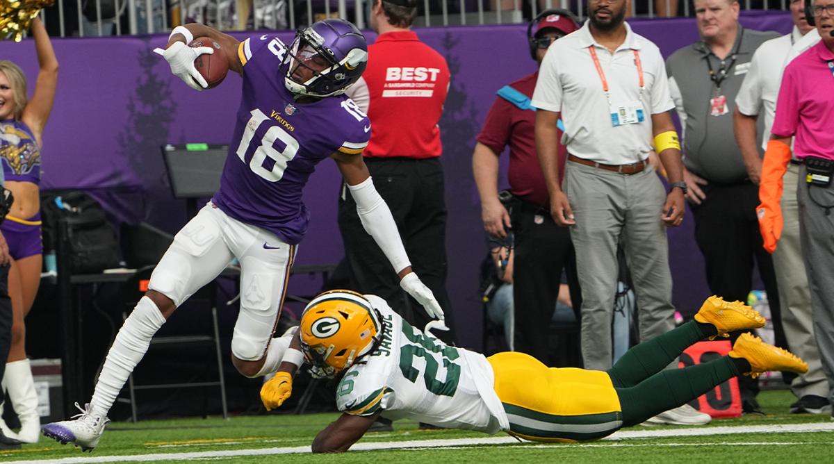 Minnesota Vikings wide receiver Justin Jefferson (18) picks up 64 yards on a reception while being covered by Green Bay Packers safety Darnell Savage (26) during the second quarter of their game Sunday, September 11, 2022 at U.S. Bank Stadium in Minneapolis, Minn.