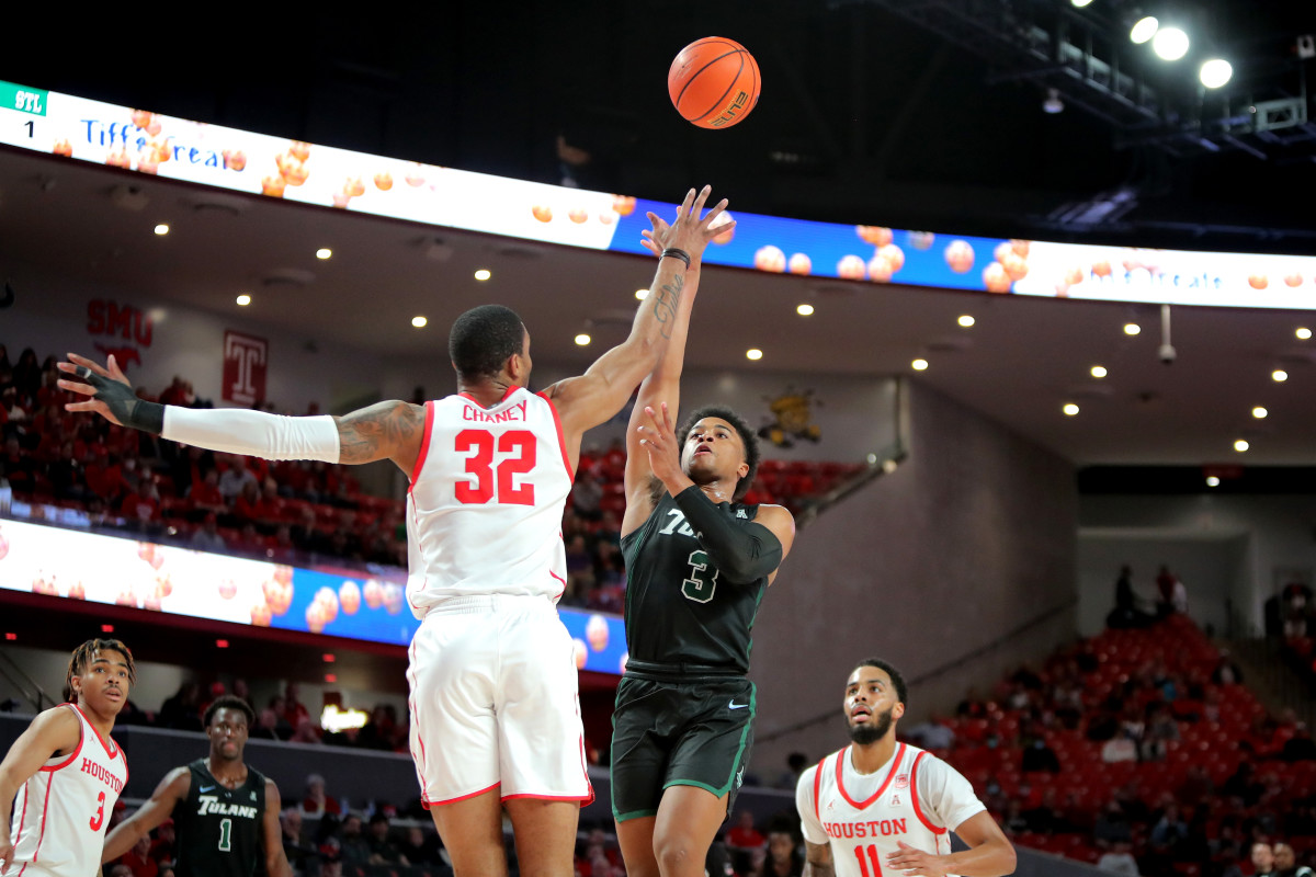 Feb 2, 2022; Houston, Texas, USA; Tulane Green Wave guard Jalen Cook (3) attempts a layup while Houston Cougars forward Reggie Chaney (32) defends during the first half at Fertitta Center. Mandatory Credit: Erik Williams-USA TODAY Sports