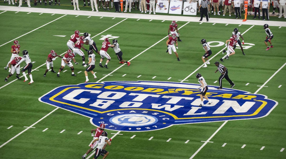 A view of the midfield Cotton Bowl logo surrounded by game action during the 2021 Cotton Bowl
