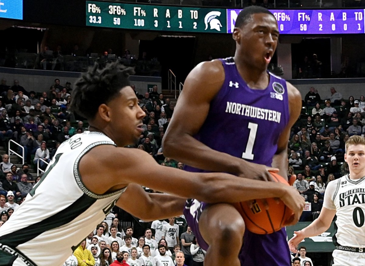 Northwestern guard Chase Audige (1) gets stopped by Michigan State Spartans guard A.J. Hoggard (11). (Dale Young-USA TODAY Sports)
