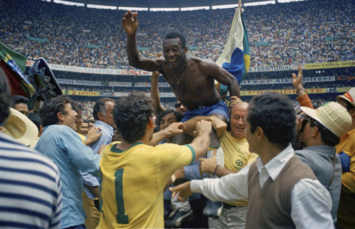 Pele pictured being carried by his Brazil teammates after helping them beat Italy 4-1 in the 1970 World Cup final