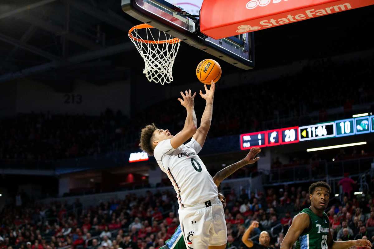 Cincinnati Bearcats guard Daniel Skillings (0) makes a layup during the first half of an NCAA men s college basketball game on Thursday, Dec. 29, 2022, at Fifth Third Arena in Cincinnati. The Bearcats defeated the Green Wave 88-77 with a crowd of 9,484. Tulane Green Wave At Cincinnati Bearcats Ncaa Basketball Dec 29