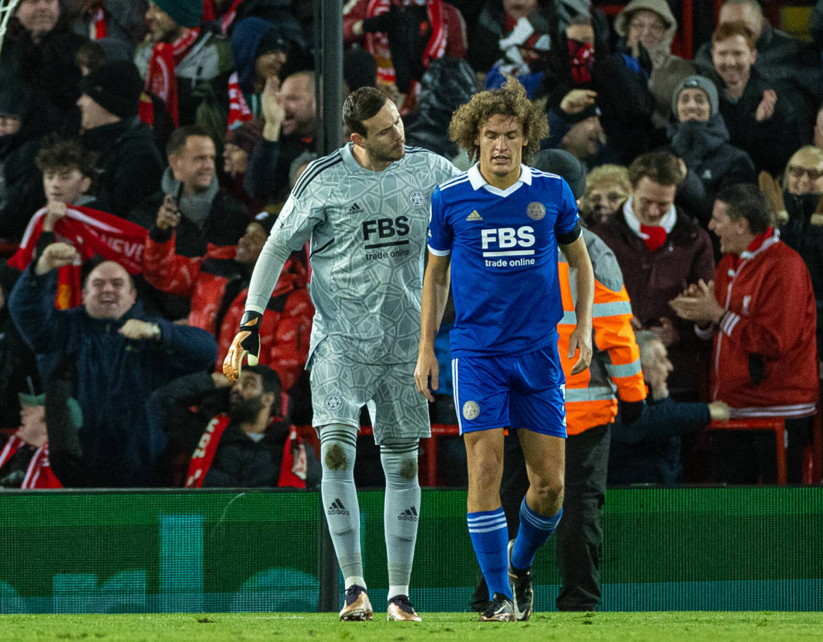 Leicester City defender Wout Faes pictured (right) being consoled by Danny Ward after scoring an own goal against Liverpool