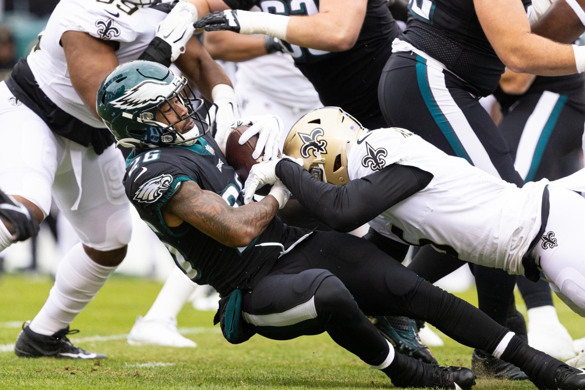 Nov 21, 2021; Philadelphia Eagles running back Miles Sanders (26) is stopped for a loss by the New Orleans Saints. Mandatory Credit: Bill Streicher-USA TODAY